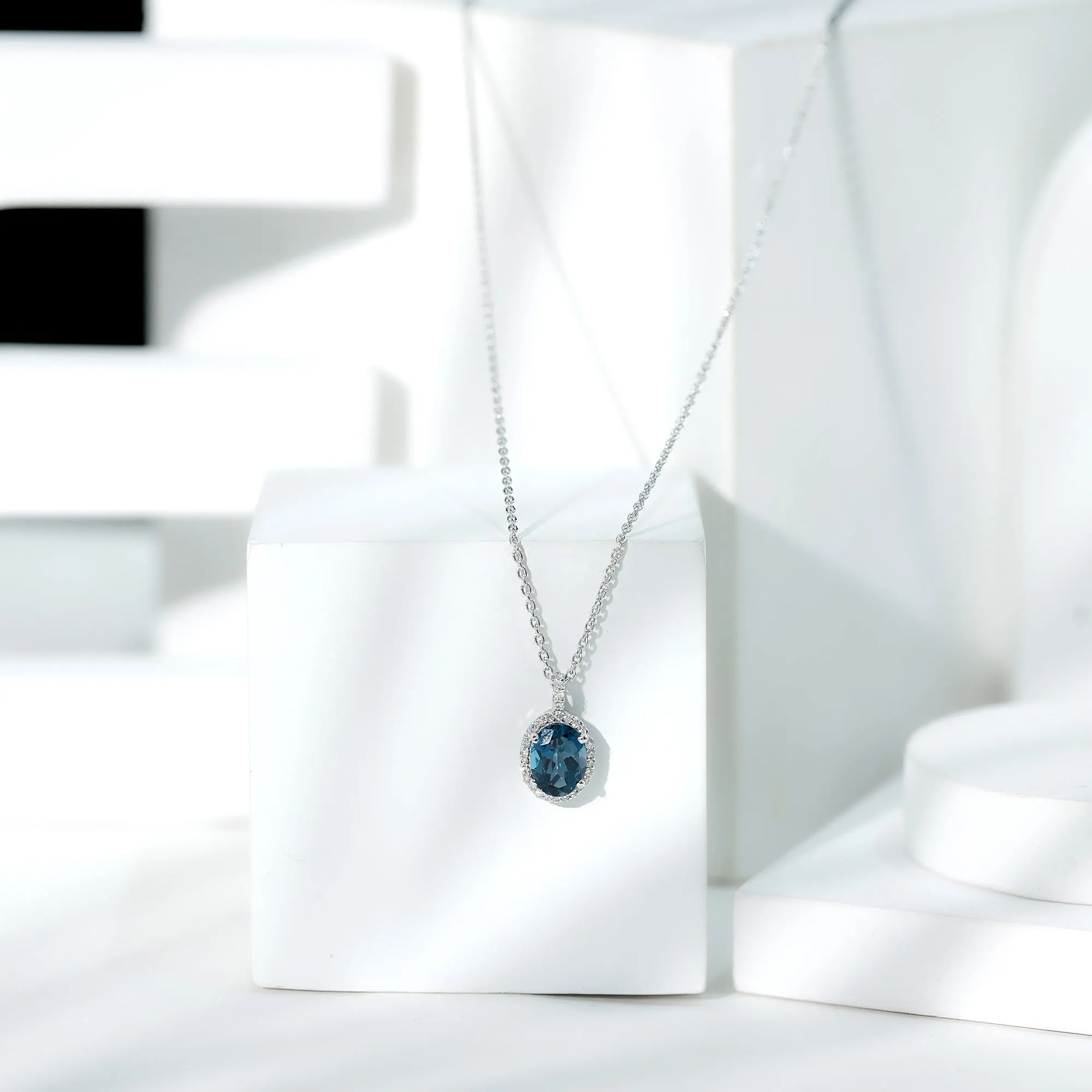 Classic Oval London Blue Topaz and Diamond Halo Pendant