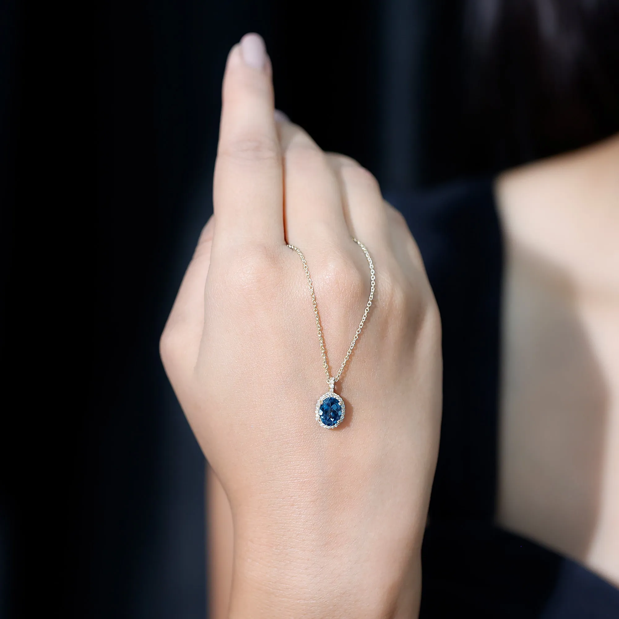 Classic Oval London Blue Topaz and Diamond Halo Pendant