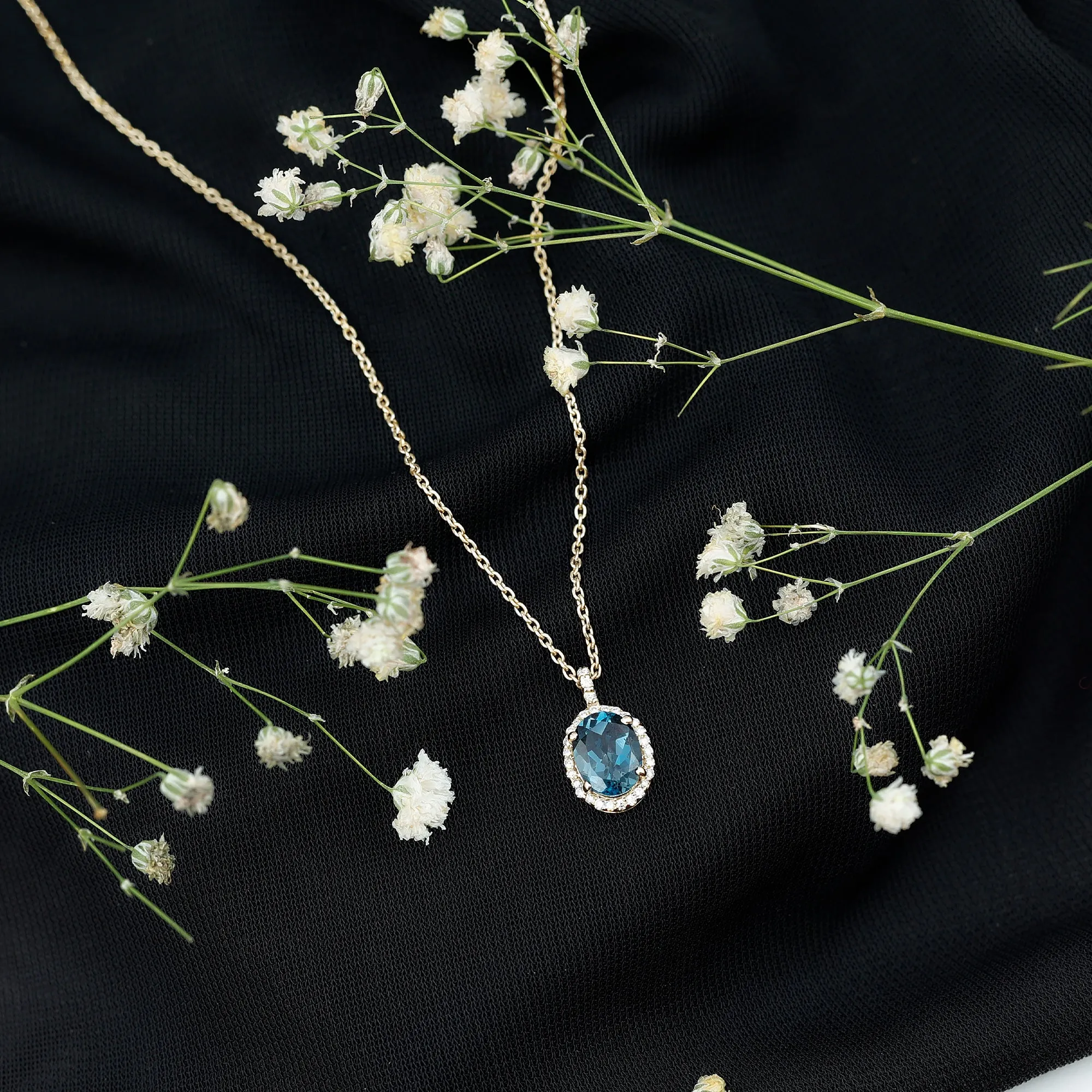 Classic Oval London Blue Topaz and Diamond Halo Pendant