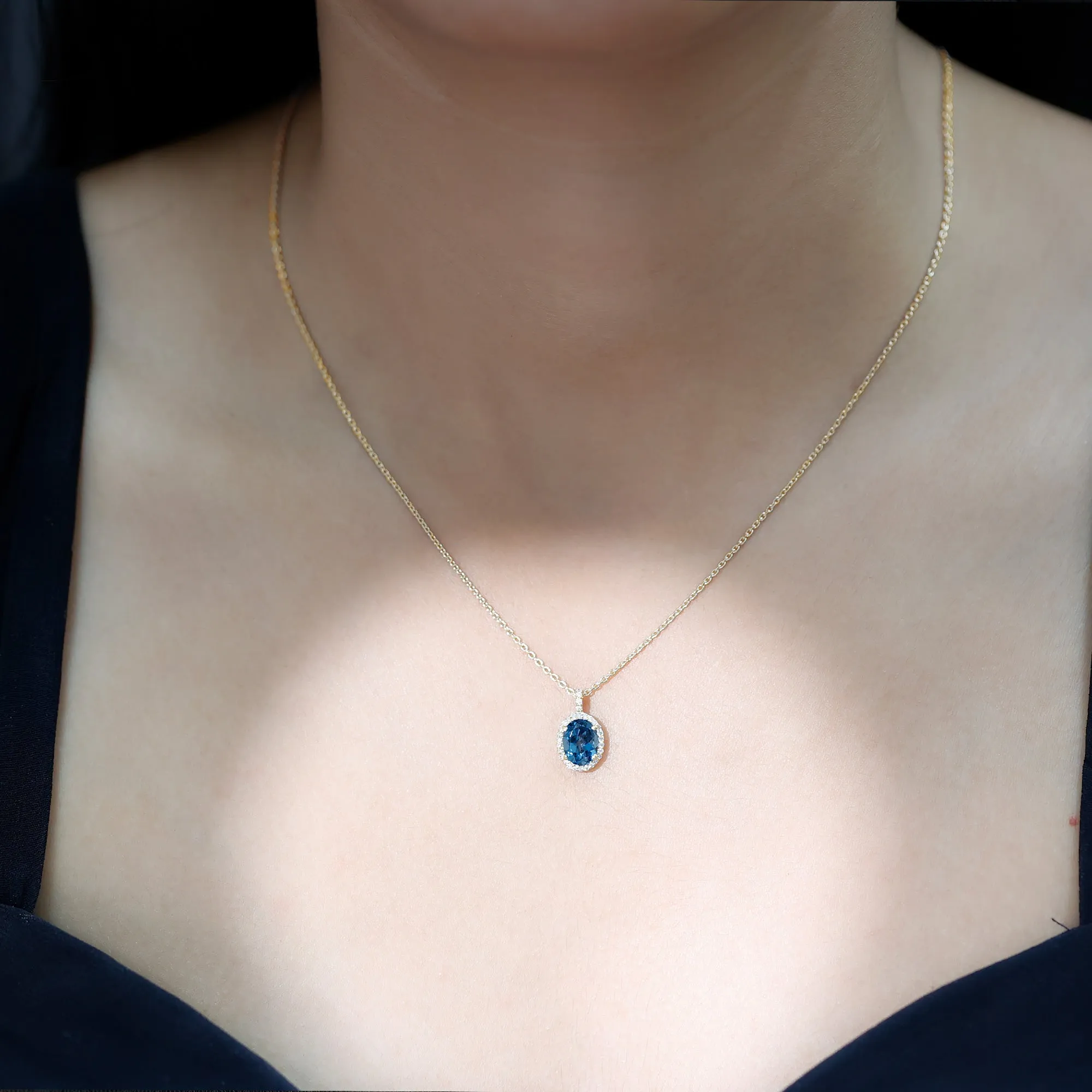 Classic Oval London Blue Topaz and Diamond Halo Pendant