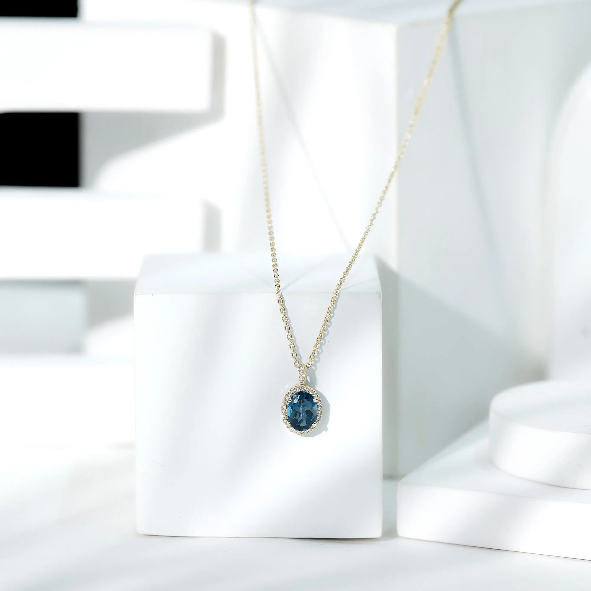 Classic Oval London Blue Topaz and Diamond Halo Pendant