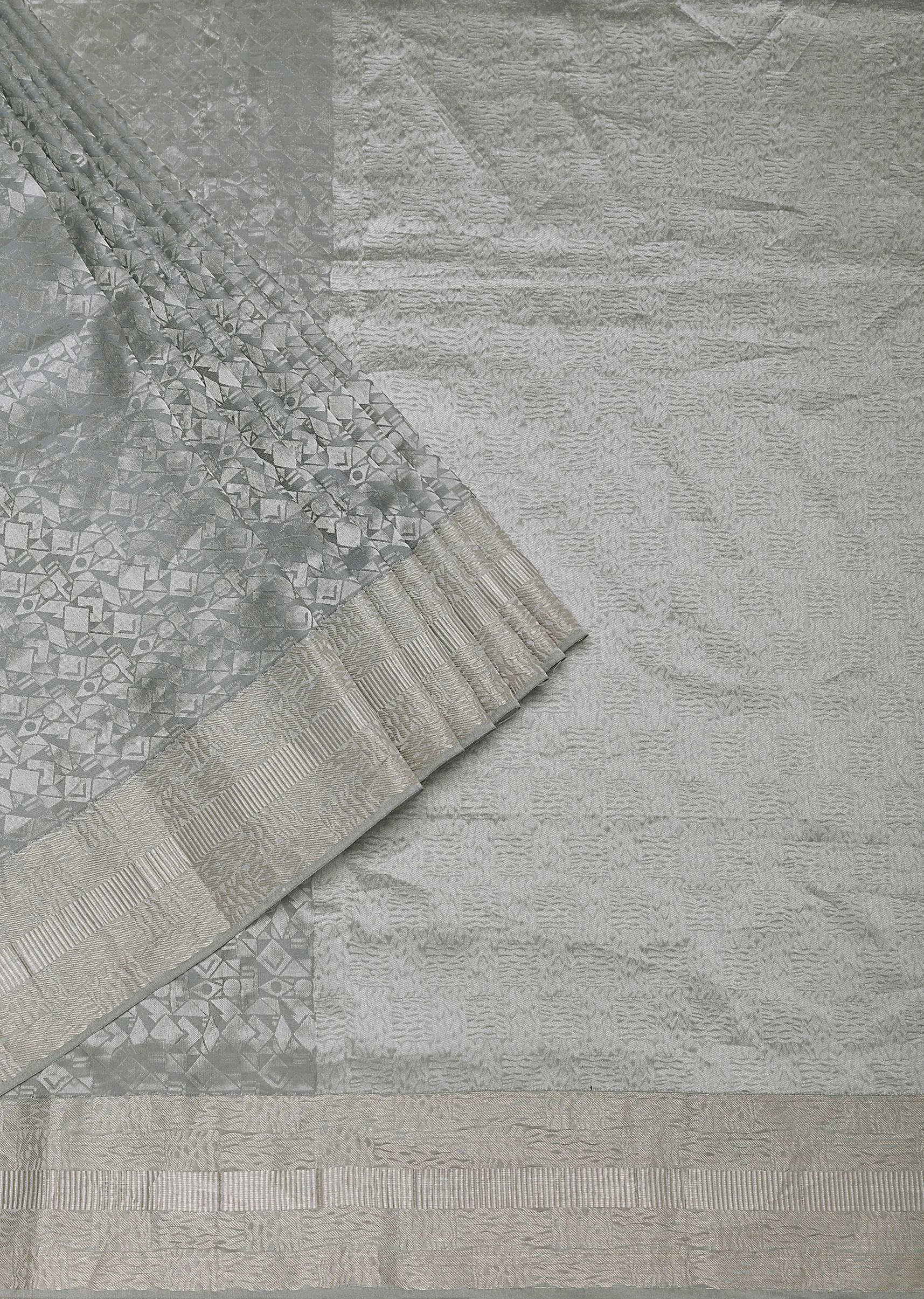 Grey South Silk Saree With Abstract Zari Border And Unstitched Blouse Fabric